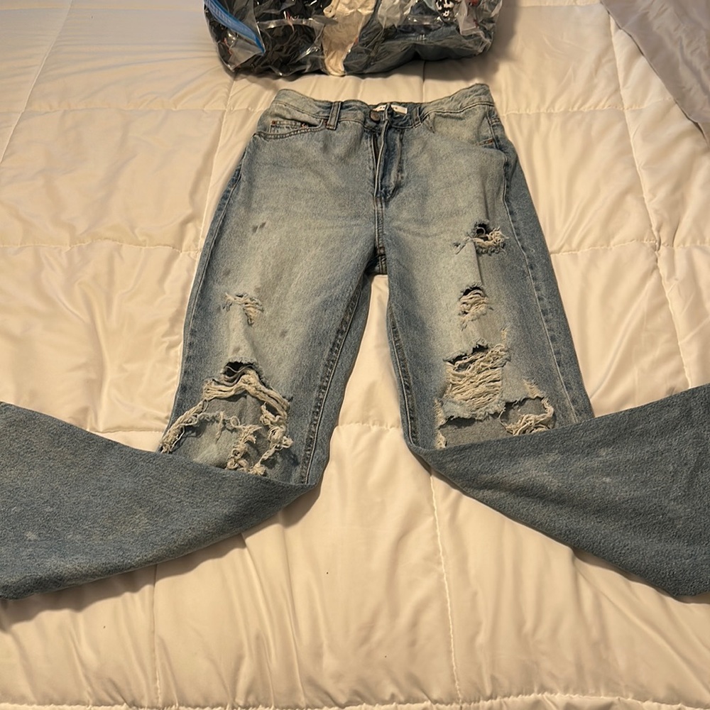 Super distressed jeans like new